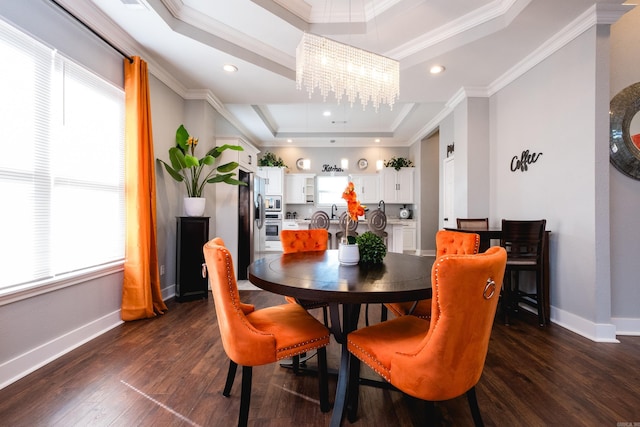 1608 S Cross St, Little Rock, AR 72206 - dining room with a tray ceiling, a chandelier, dark wood-style floors, baseboards, and ornamental molding