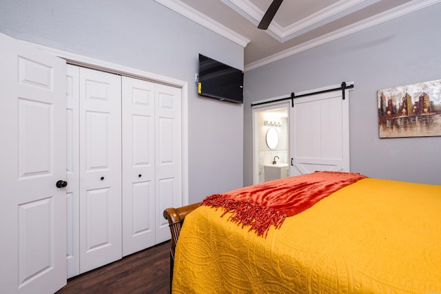 1608 S Cross St, Little Rock, AR 72206 - bedroom with ornamental molding, a barn door, dark wood-style flooring, a closet, and ensuite bathroom