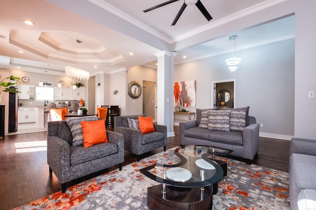 1608 S Cross St, Little Rock, AR 72206 - living area featuring dark wood finished floors, ceiling fan, crown molding, ornate columns, and a tray ceiling