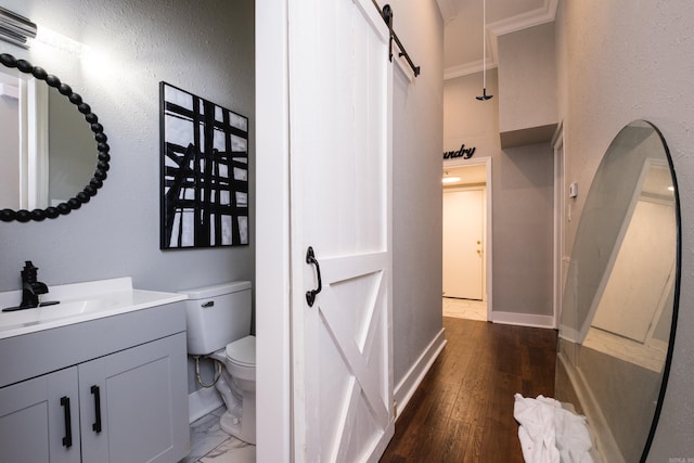 1608 S Cross St, Little Rock, AR 72206 - bathroom with toilet, crown molding, vanity, baseboards, and a high ceiling