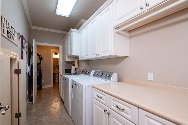 5718 Mediterranean Blvd, Benton, AR 72019 - washroom featuring cabinet space, washing machine and clothes dryer, stone tile floors, crown molding, and baseboards