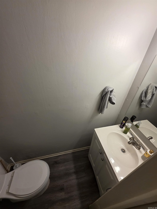 2113AND2115 Scotty Ct, Little Rock, AR 72204 - bathroom featuring wood finished floors, vanity, and toilet