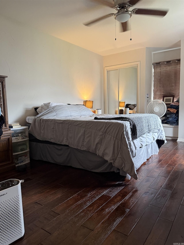bedroom featuring wood-type flooring and a ceiling fan