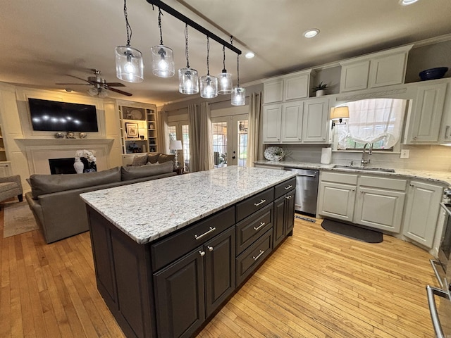 615 Miller Cv, Benton, AR 72019 - kitchen featuring stainless steel dishwasher, a sink, white cabinets, a ceiling fan, and recessed lighting