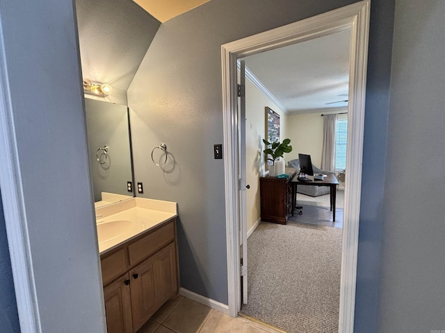 615 Miller Cv, Benton, AR 72019 - bathroom featuring crown molding, vanity, baseboards, and tile patterned flooring