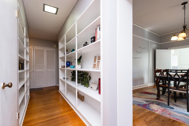 1224 S Fillmore St, Little Rock, AR 72204 - corridor featuring wood finished floors and a chandelier