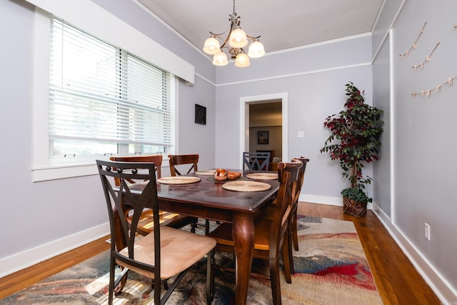 1224 S Fillmore St, Little Rock, AR 72204 - dining space with a chandelier, wood finished floors, ornamental molding, and baseboards