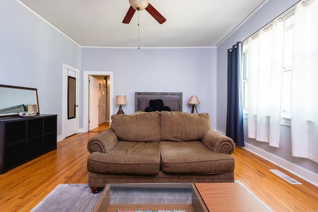 1224 S Fillmore St, Little Rock, AR 72204 - living area with ornamental molding, light wood-type flooring, a ceiling fan, and baseboards