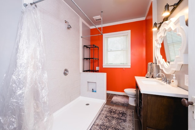 1224 S Fillmore St, Little Rock, AR 72204 - full bathroom featuring tiled shower, toilet, vanity, tile patterned flooring, and baseboards