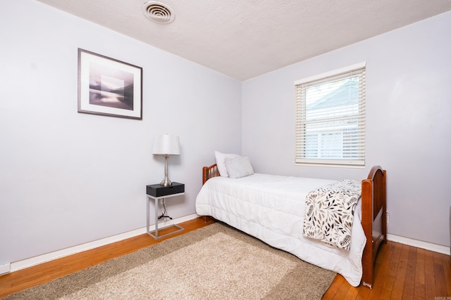 1224 S Fillmore St, Little Rock, AR 72204 - bedroom with wood-type flooring and baseboards