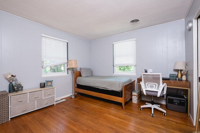 1224 S Fillmore St, Little Rock, AR 72204 - bedroom featuring wood finished floors and multiple windows
