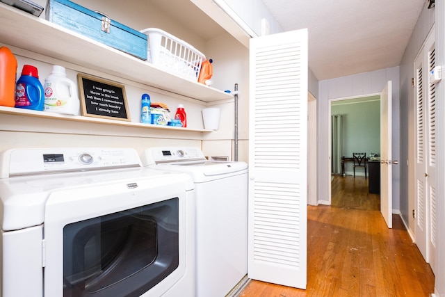 1224 S Fillmore St, Little Rock, AR 72204 - laundry area with washer and clothes dryer and light wood finished floors