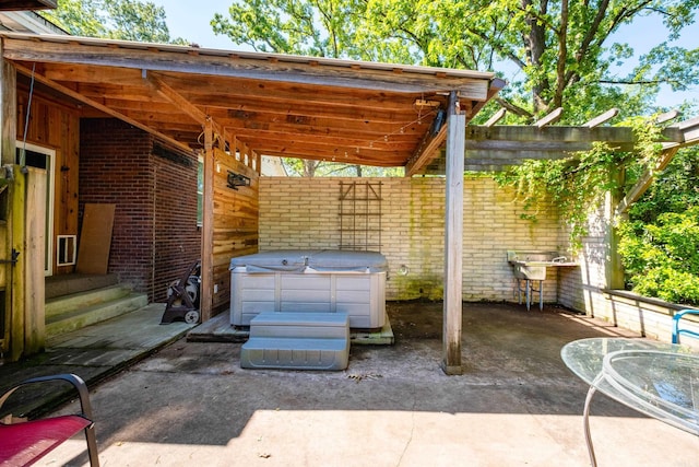 1224 S Fillmore St, Little Rock, AR 72204 - view of patio / terrace featuring a hot tub and entry steps
