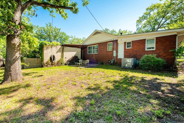 1224 S Fillmore St, Little Rock, AR 72204 - back of property with brick siding, a patio, and cooling unit