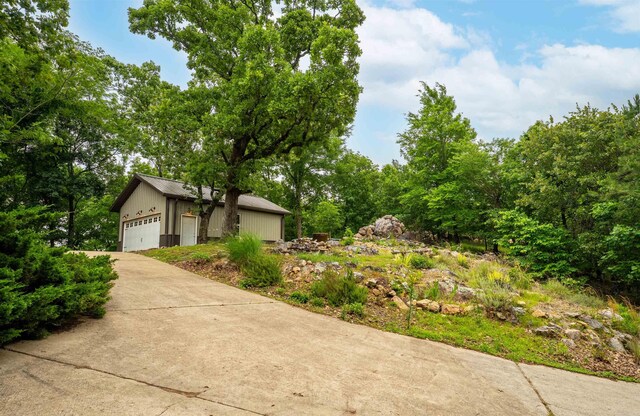 view of front of property with an outdoor structure and a garage