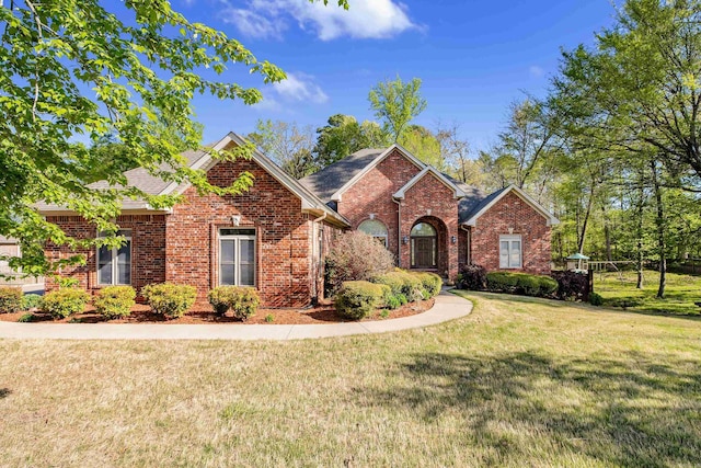 5410 Lexington Ave, Benton, AR 72019 - traditional-style home featuring brick siding and a front lawn