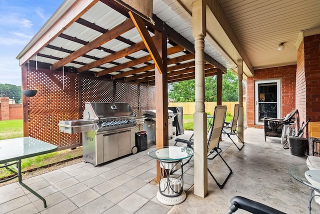 view of patio / terrace featuring a grill and fence