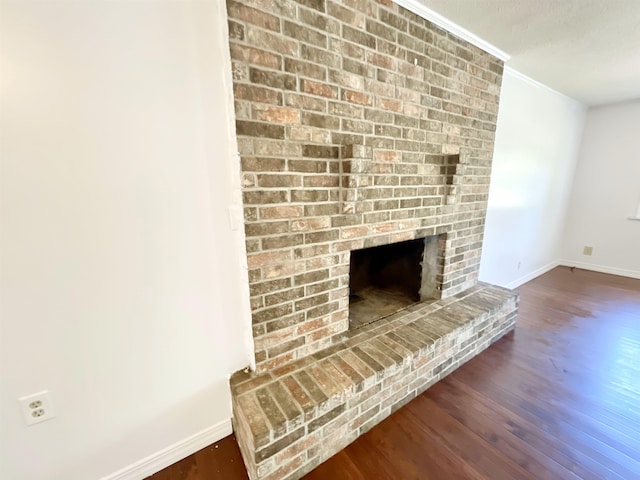 806 Autumnwood Rd, Ash Flat, AR 72513 - detailed view of wood finished floors, baseboards, a fireplace, and ornamental molding
