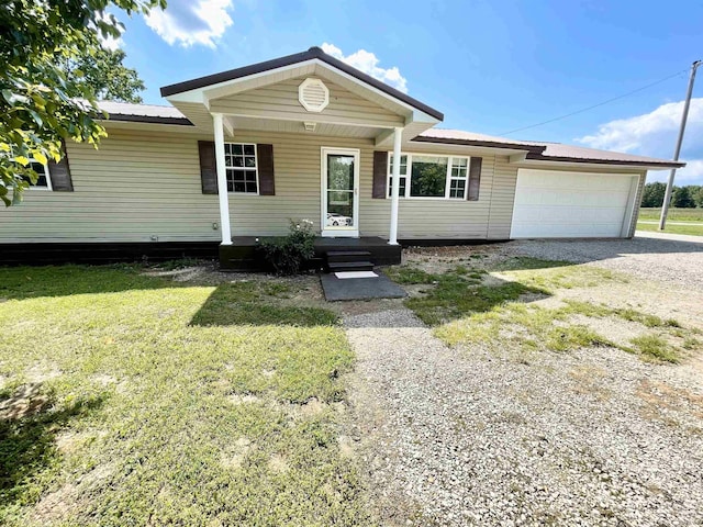806 Autumnwood Rd, Ash Flat, AR 72513 - view of front facade with driveway, a garage, a front yard, and a porch