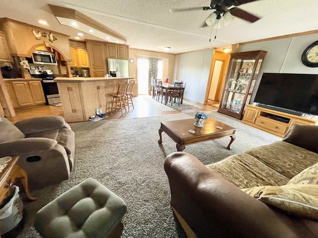 806 Autumnwood Rd, Ash Flat, AR 72513 - living area with a textured ceiling, a ceiling fan, recessed lighting, and crown molding