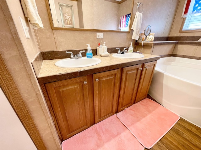 806 Autumnwood Rd, Ash Flat, AR 72513 - full bath featuring a bath, double vanity, and wood finished floors
