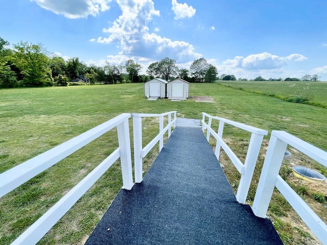 806 Autumnwood Rd, Ash Flat, AR 72513 - view of green lawn with a storage unit, an outdoor structure, and a view of rural / pastoral area