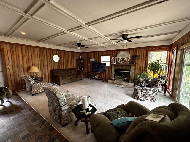 340 Griffin Rd, Hardy, AR 72542 - living room with wooden walls, ceiling fan, coffered ceiling, and a fireplace