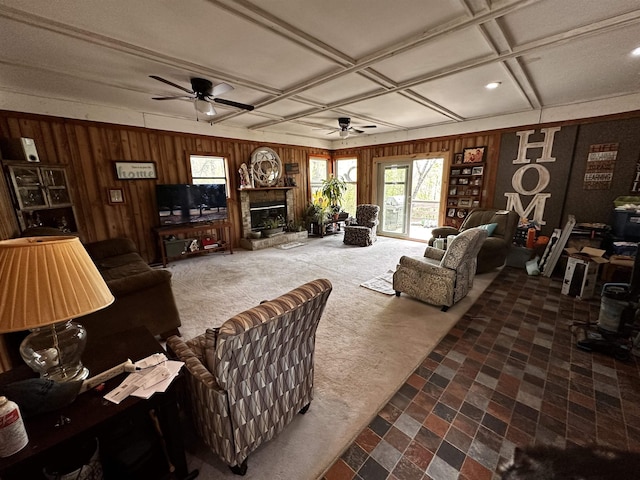 340 Griffin Rd, Hardy, AR 72542 - living area with carpet floors, a ceiling fan, wooden walls, a glass covered fireplace, and coffered ceiling