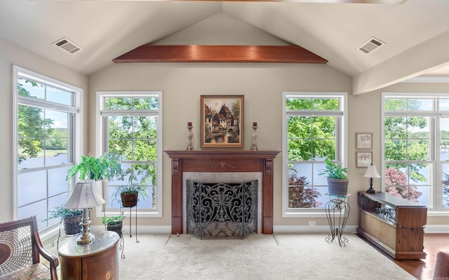 26 Pillar Ln, Hot Springs Village, AR 71909 - living room with lofted ceiling, a premium fireplace, healthy amount of natural light, carpet flooring, and baseboards