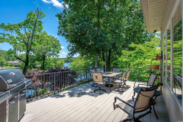 26 Pillar Ln, Hot Springs Village, AR 71909 - wooden terrace featuring a grill and outdoor dining area