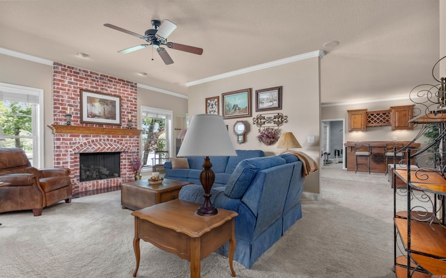 26 Pillar Ln, Hot Springs Village, AR 71909 - living area featuring light carpet, ornamental molding, ceiling fan, and a fireplace