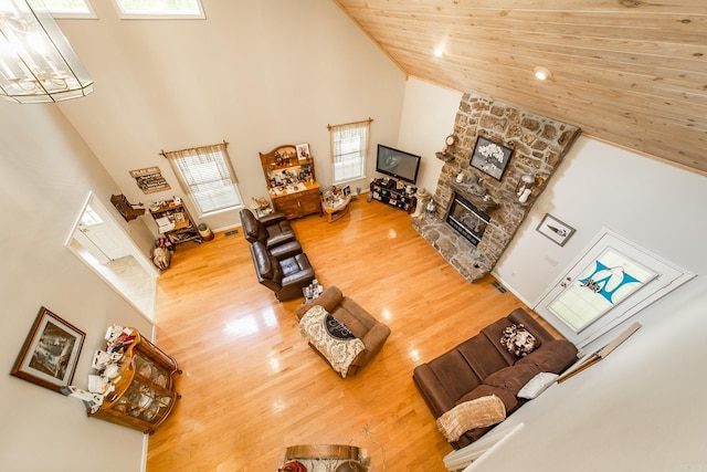 420 Shadow Ln, Clinton, AR 72031 - living area with high vaulted ceiling, wood finished floors, a fireplace, and wood ceiling