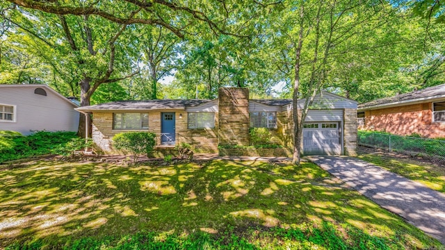 1118 Garland, North Little Rock, AR 72216 - view of front of house with driveway, a chimney, an attached garage, and stone siding