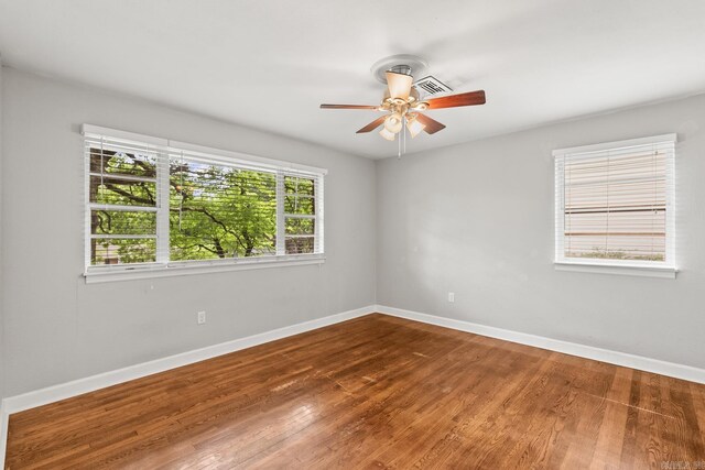 1118 Garland, North Little Rock, AR 72216 - spare room featuring ceiling fan, baseboards, and wood finished floors