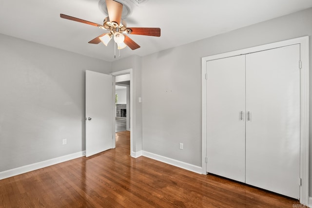1118 Garland, North Little Rock, AR 72216 - unfurnished bedroom featuring baseboards, wood finished floors, a ceiling fan, and a closet