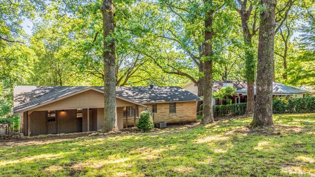 1118 Garland, North Little Rock, AR 72216 - ranch-style house featuring a front yard and central air condition unit