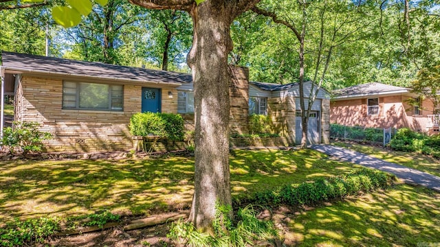 1118 Garland, North Little Rock, AR 72216 - single story home with driveway, a front yard, and stone siding