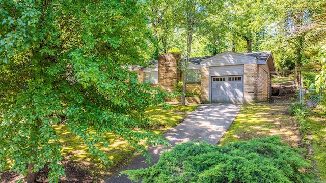 1118 Garland, North Little Rock, AR 72216 - view of outbuilding with driveway and an attached garage
