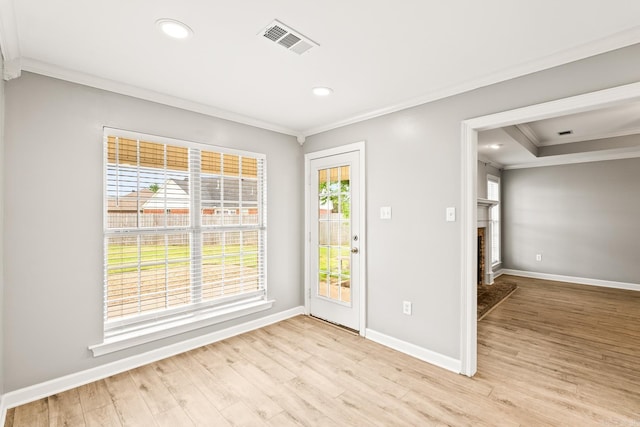 2340 Morning Glory, Conway, AR 72034 - spare room with ornamental molding, baseboards, light wood-style floors, a fireplace with raised hearth, and recessed lighting