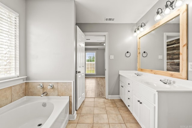2340 Morning Glory, Conway, AR 72034 - full bath with a garden tub, tile patterned floors, double vanity, and baseboards