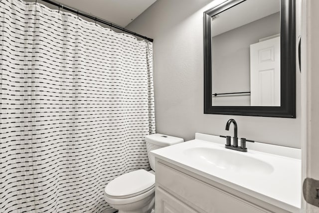 2340 Morning Glory, Conway, AR 72034 - bathroom featuring toilet, vanity, a textured wall, and a shower with shower curtain