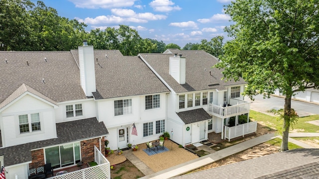 1005 S German, Conway, AR 72034 - rear view of house featuring a chimney and a shingled roof