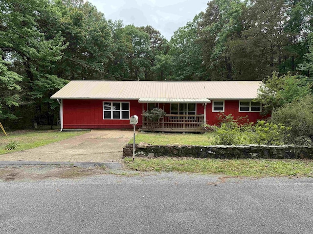 122 Meadow Cliff Cir, Fairfield Bay, AR 72088 - ranch-style home with metal roof, a porch, and a view of trees