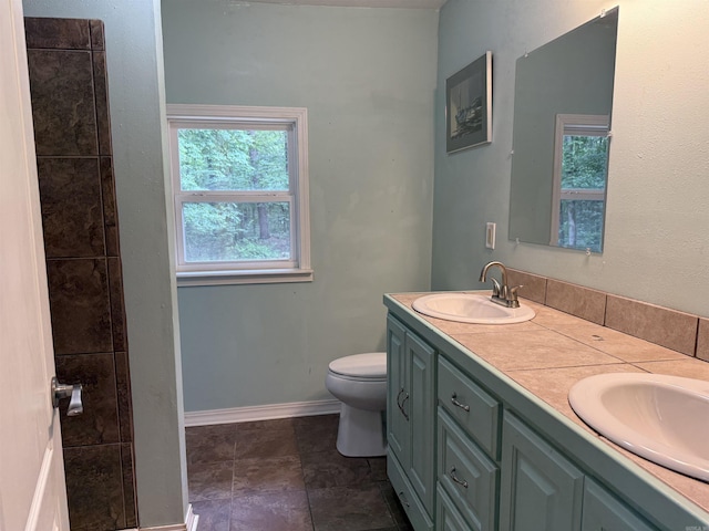 122 Meadow Cliff Cir, Fairfield Bay, AR 72088 - full bath featuring double vanity, plenty of natural light, toilet, and baseboards