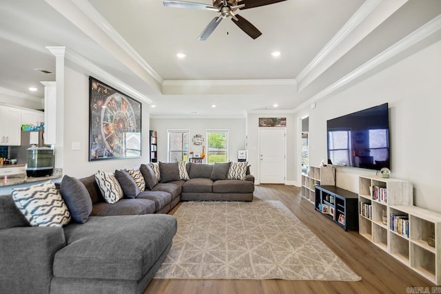 4532 Western Woods Dr, Benton, AR 72015 - living room featuring a ceiling fan, wood finished floors, a tray ceiling, ornamental molding, and recessed lighting