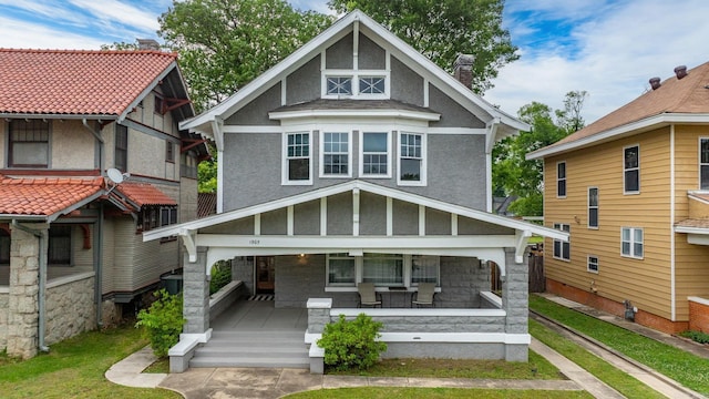 1905 S Battery St, Little Rock, AR 72202 - view of front of property with a chimney, a porch, and stucco siding