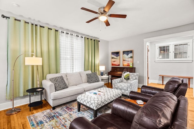 1905 S Battery St, Little Rock, AR 72202 - living area featuring baseboards, wood finished floors, and ceiling fan