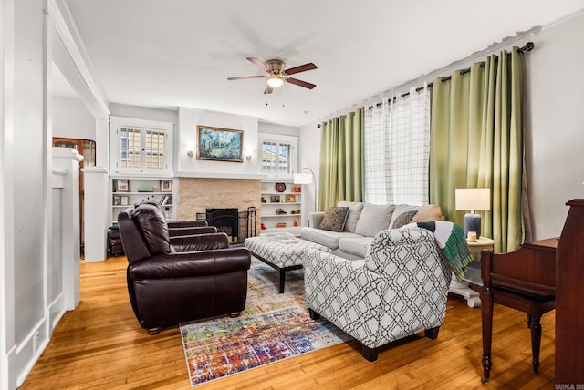 1905 S Battery St, Little Rock, AR 72202 - living room with ceiling fan, wood finished floors, and a fireplace