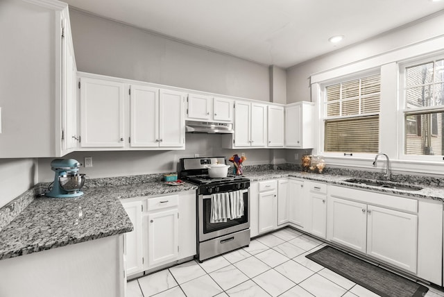1905 S Battery St, Little Rock, AR 72202 - kitchen featuring stainless steel range with gas cooktop, under cabinet range hood, a sink, white cabinets, and light stone counters