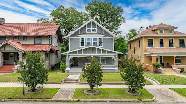 1905 S Battery St, Little Rock, AR 72202 - view of front facade featuring covered porch and a front yard